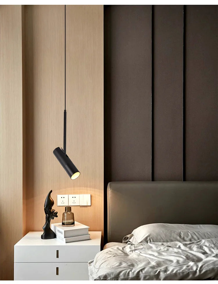 Polanthos spotlight pendant in matte black, bedside lifestyle