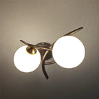 Articulated Metal Arm Wall Sconce Calmeth in brushed gold – living room lifestyle