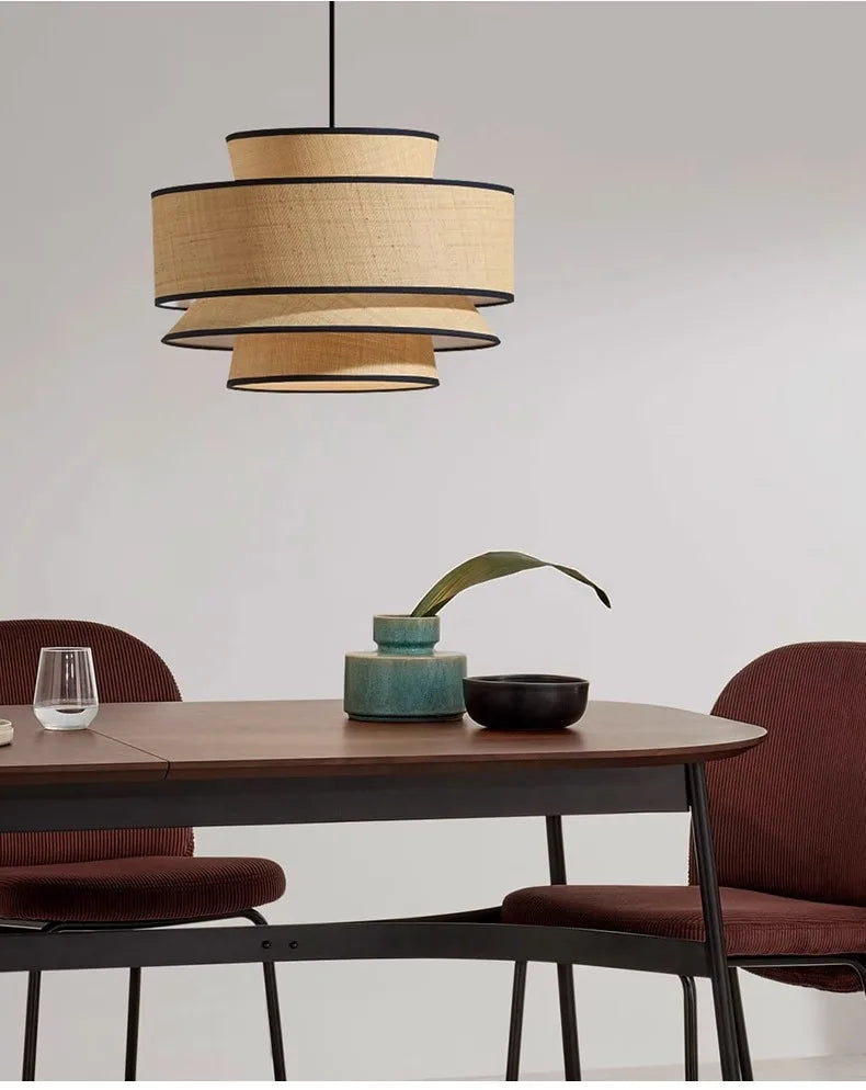 Solara pendant light — Tiered silhouette above dining table
