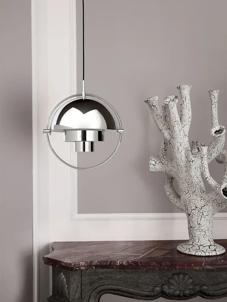 Rotating dome pendant light Axion in chrome finish, bedroom setting