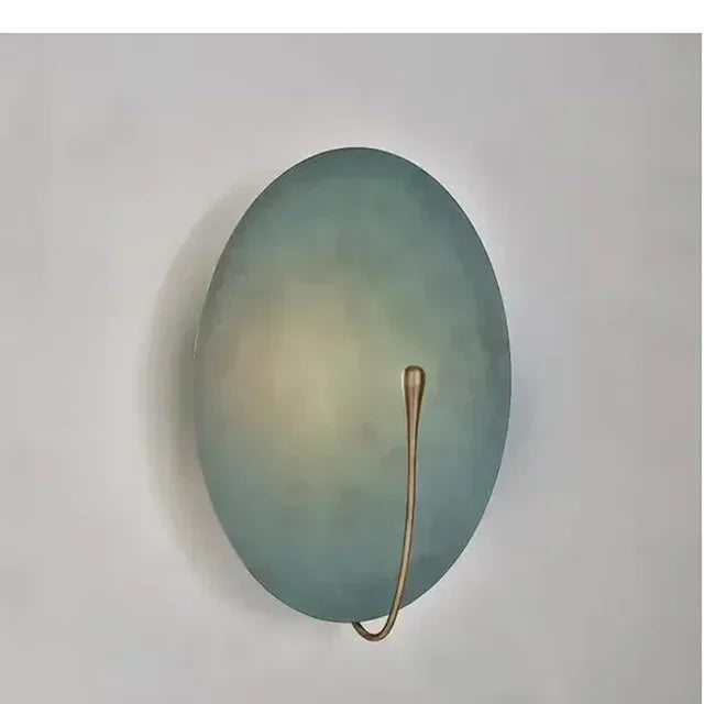 Eclipse Disc Wall Sconce – Selenyx – angled view showing pull-switch cord, Painted Blue