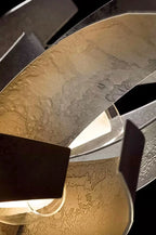Sculptural Metal Ribbon Chandelier Karox – Hammered Metal Texture Detail