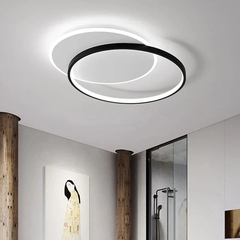 Orvena round ceiling light installed in a hallway with a walk-in shower in view