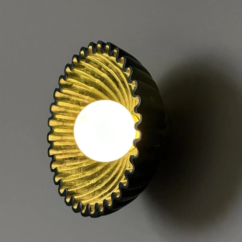 Sunburst Ridged Disc Wall Light – Hevorn – Antique Gold, side profile lit