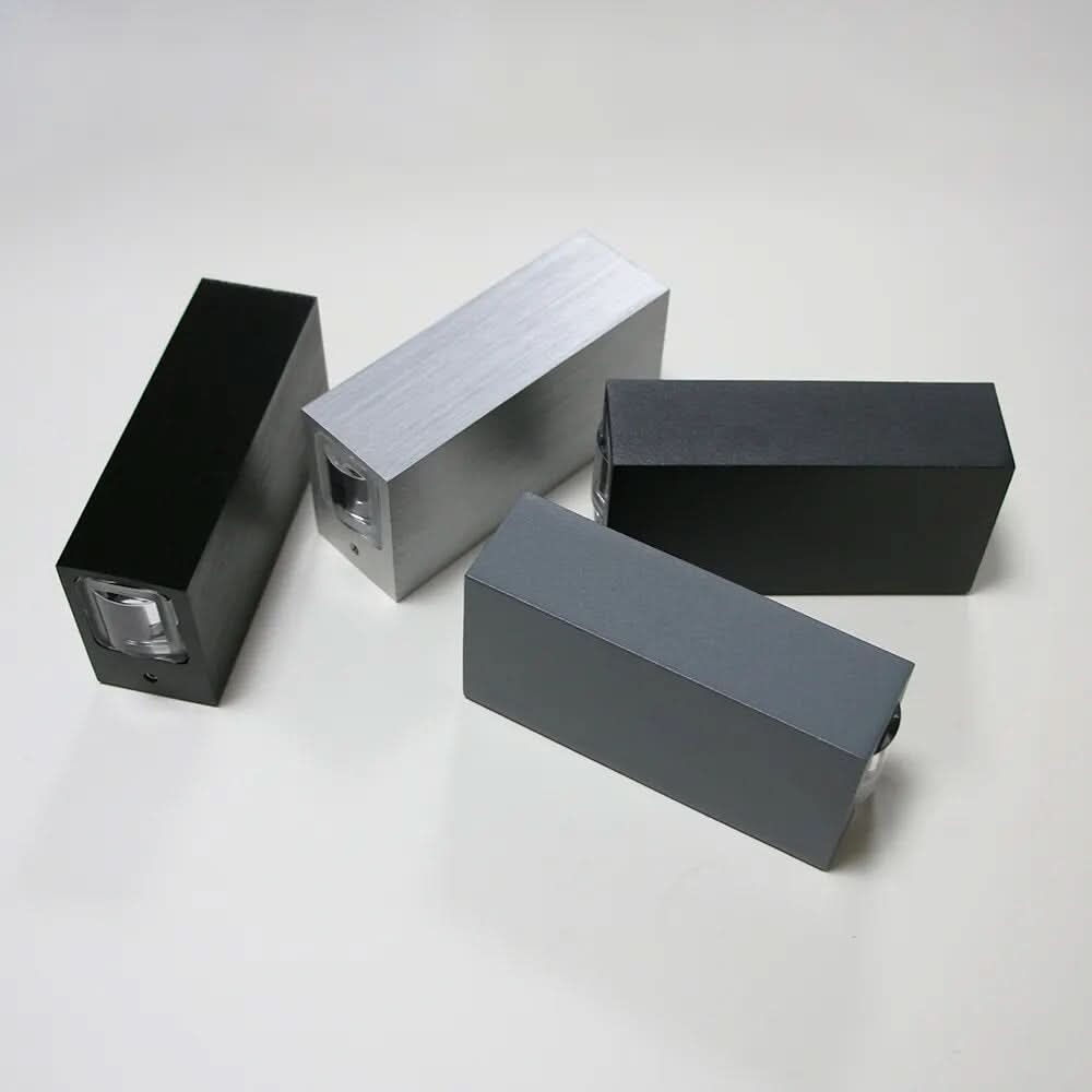 Antevo LED wall sconce shown in four finishes