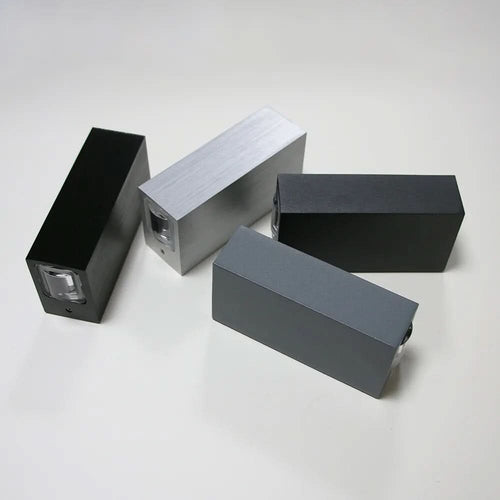 Antevo LED wall sconce shown in four finishes