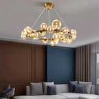 Zwaeron ring chandelier — lifestyle, gold finish with amber glass globes