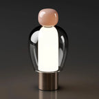 Harovant table lamp, Blush Cap – Bronze Base finish, lit