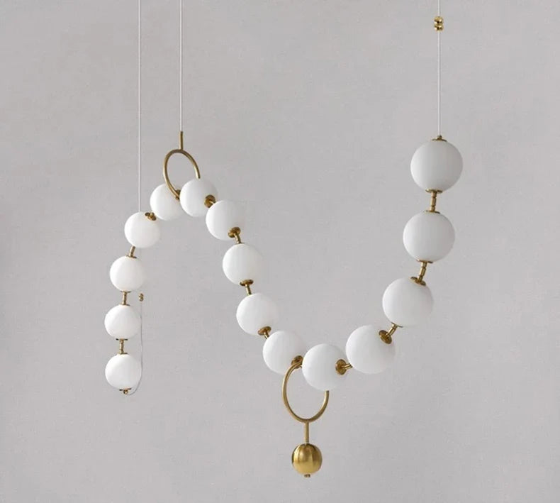 Sculptural Glass Orb Chandelier Ilnox - opal glass sphere and brass fitting detail