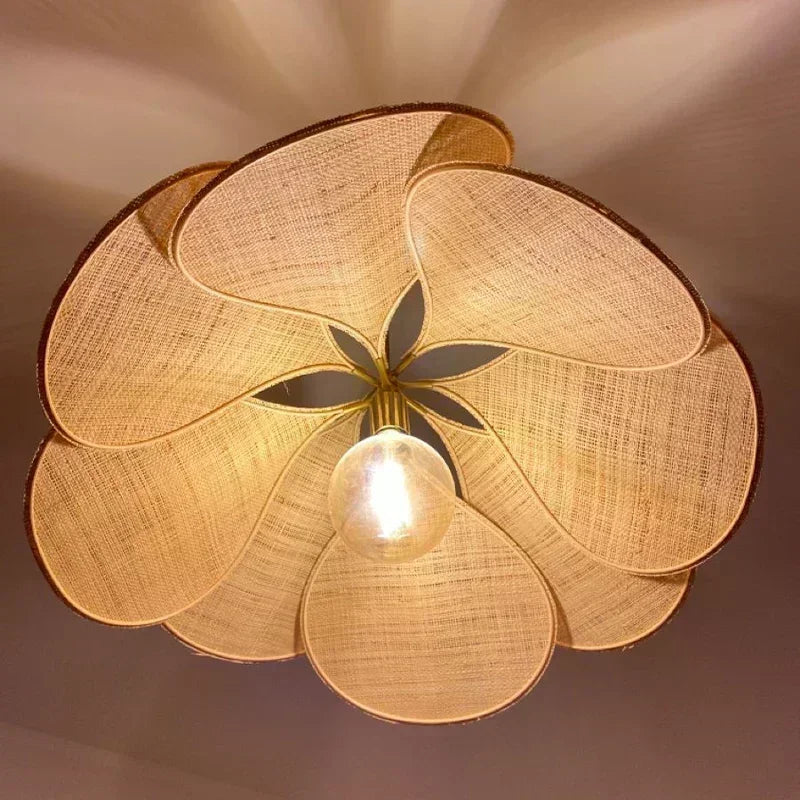Uzaelvin petal lamp – close-up from below showing fabric texture and brass fitting