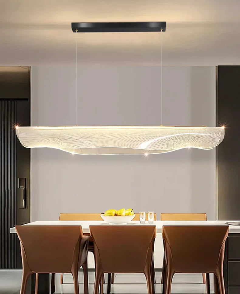 Woven Mesh Wave Pendant Light – Gaion, Matte Black finish above a dining table