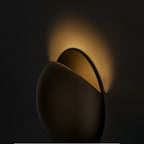 Brivex directional wall sconce, Gloss Black finish, close mood shot