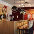 Warm Metal Disc Pendant Light Axion – Hero Shot