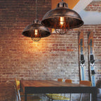 Caldorix Caged Dome pendant in Rust finish, dining room with exposed brick