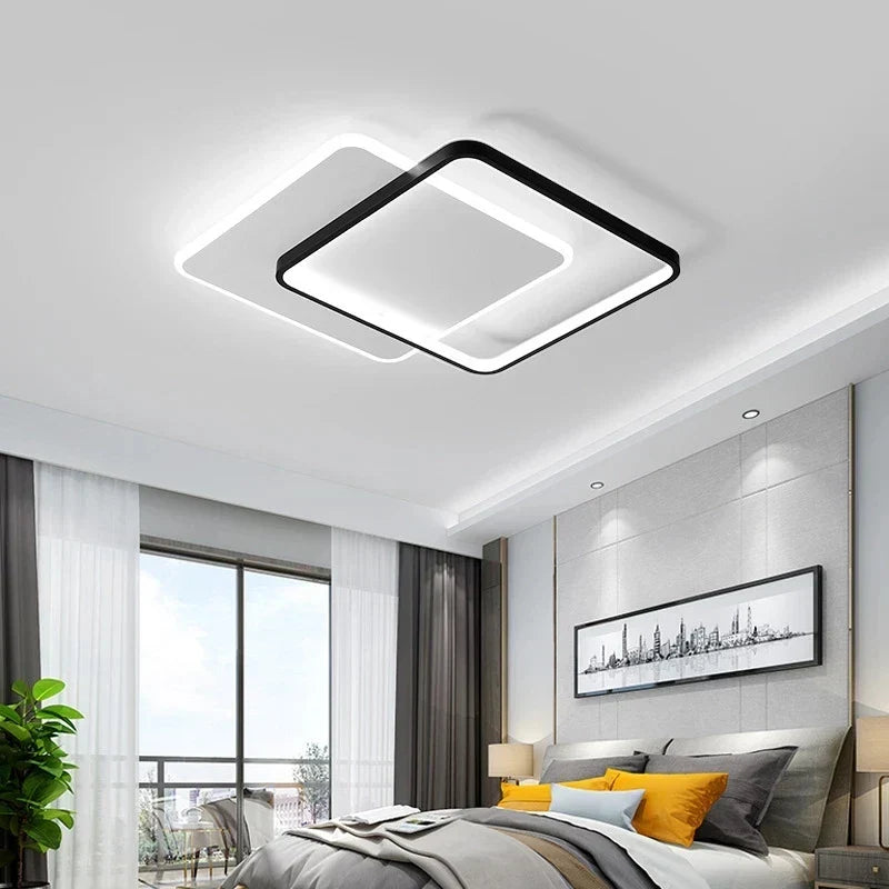 Orvena square ceiling light in a bright modern bedroom with city-print artwork