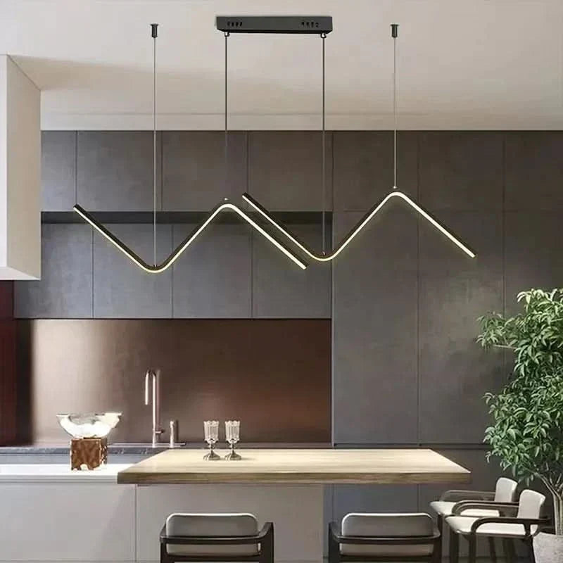 Zendrax angular zigzag LED pendant light in brushed gold above a kitchen island
