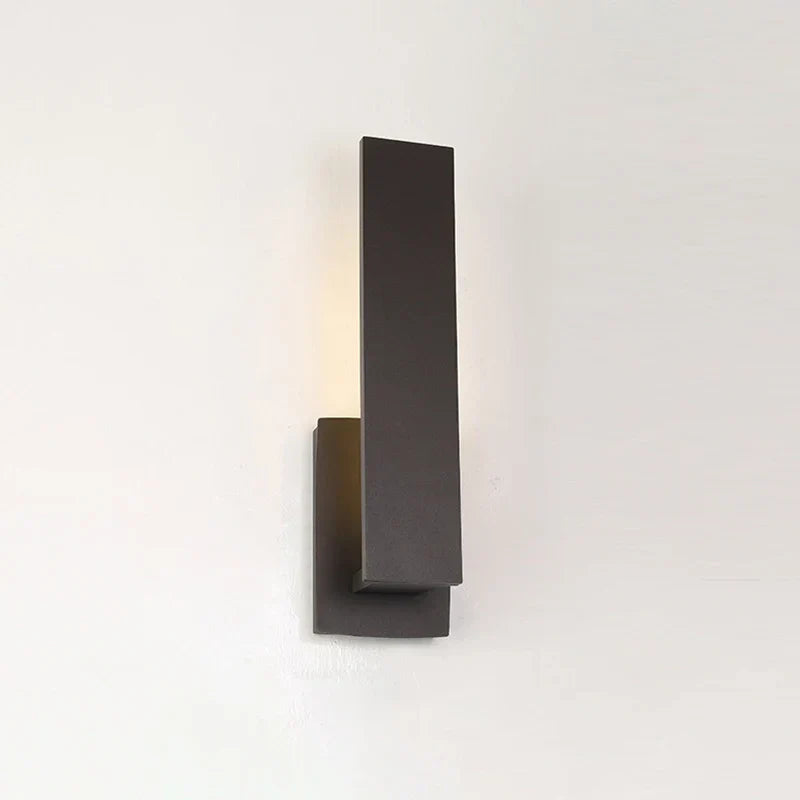 Luxenthal Large wall sconce mounted on wall with warm LED glow
