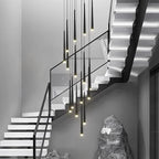 Prismex spiral cascade chandelier in Black above a staircase with sculptural stone