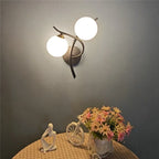 Articulated Metal Arm Wall Sconce Calmeth in matte black – living room lifestyle
