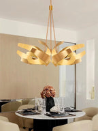 Sculptural Metal Ribbon Chandelier Karox – Brushed Gold Lifestyle Dining Detail