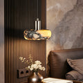 Crindova veined marble disc pendant light with natural stone shade illuminated from within