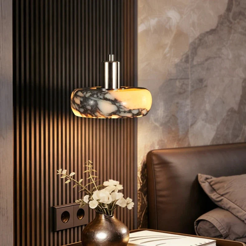 Crindova veined marble disc pendant light with natural stone shade illuminated from within