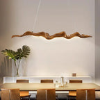 Sculptural wave-form pendant light Velorix wood-tone finish studio