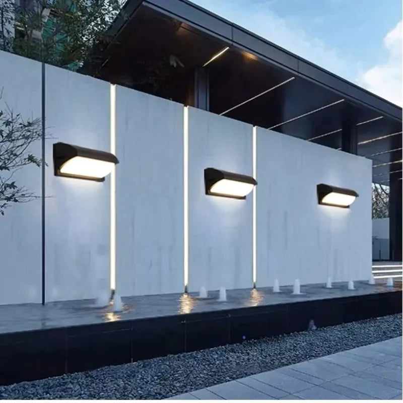 Barienth Outdoor Wall Light – Curved Configuration, on a garden accent wall