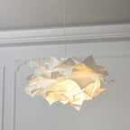 Selvoria sculptural paper pendant light – lifestyle view over dining table