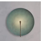 Eclipse Disc Wall Sconce – Selenyx – Painted Blue finish, wall-mounted, glowing