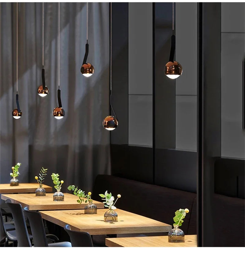 Wevonthal pendant light — twin cluster over dining table, rose gold finish