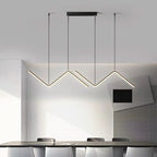 Zendrax angular zigzag LED pendant light in brushed gold above a dining table