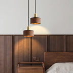 Close-up of Waelvix walnut wood shade grain with brass hardware