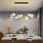 Sculptural Alloy Linear Chandelier Morvelia – Black Frame, Starlight Filament Glass, Lifestyle