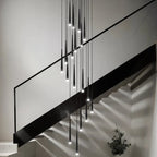 Prismex spiral cascade chandelier in Black lighting a staircase landing
