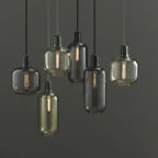 Czaelindra pendant light – multiple finishes grouped, smoke and amber glass with marble sockets