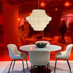 Cletya Oalaelindra sculptural silk shell pendant light with hand-pleated shade in soft ambient setting