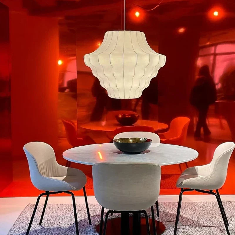 Cletya Oalaelindra sculptural silk shell pendant light with hand-pleated shade in soft ambient setting