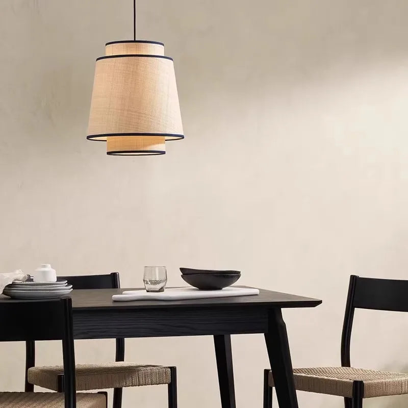 Solara pendant light — Tapered silhouette above dining table
