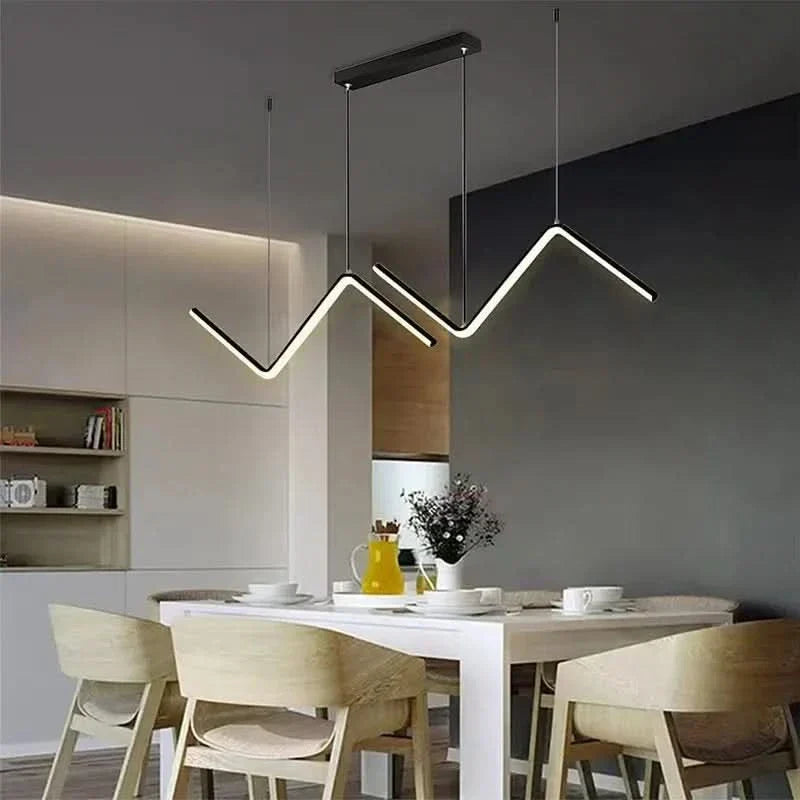 Zendrax angular zigzag LED pendant light in matte black above a dining table