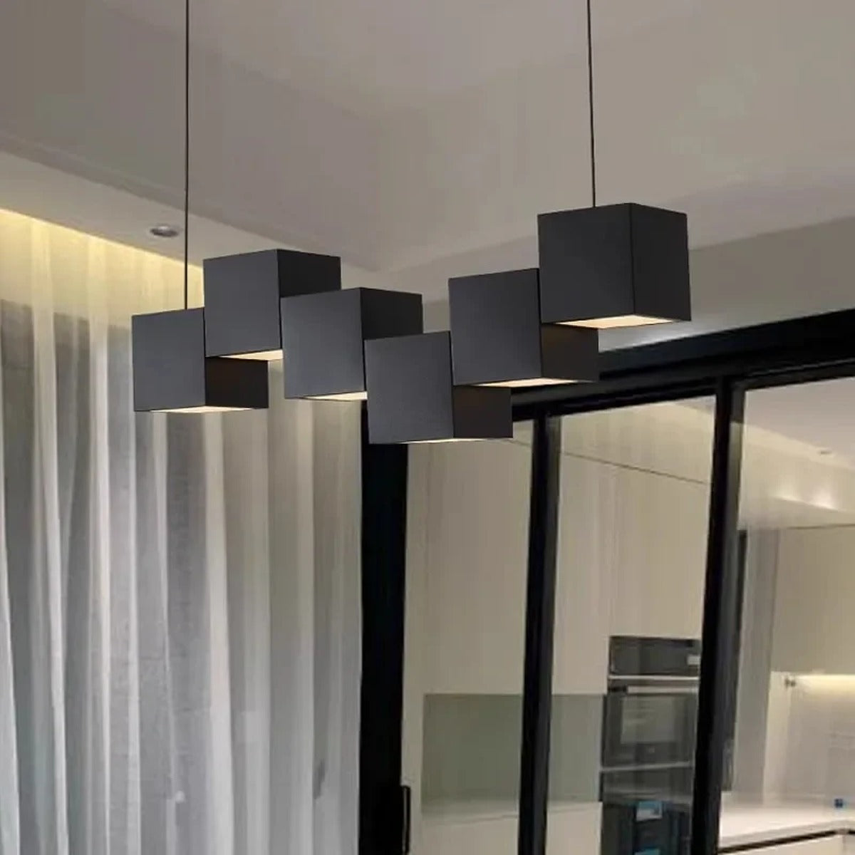 Evrixon suspended cube cluster pendant — 7-head mixed black and white configuration over dining table