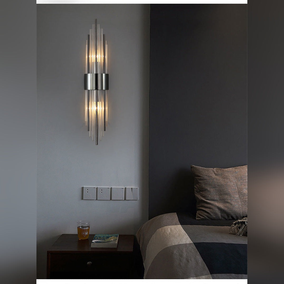 Aurelix crystal rod wall sconce in matte black, bedside lifestyle