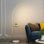 Arclume Arc Floor Lamp — Gold, living room lifestyle