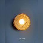 Uvrix natural jade stone wall sconce, Amber Onyx finish, lit