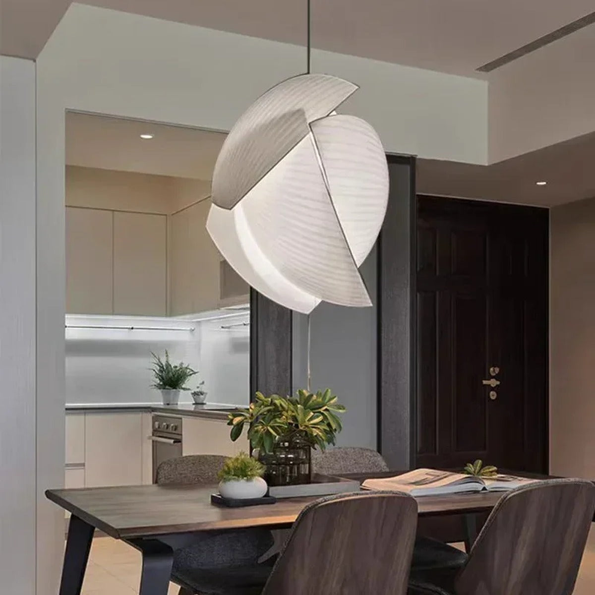 Corolla sculptural fabric pendant light — lifestyle over dining table