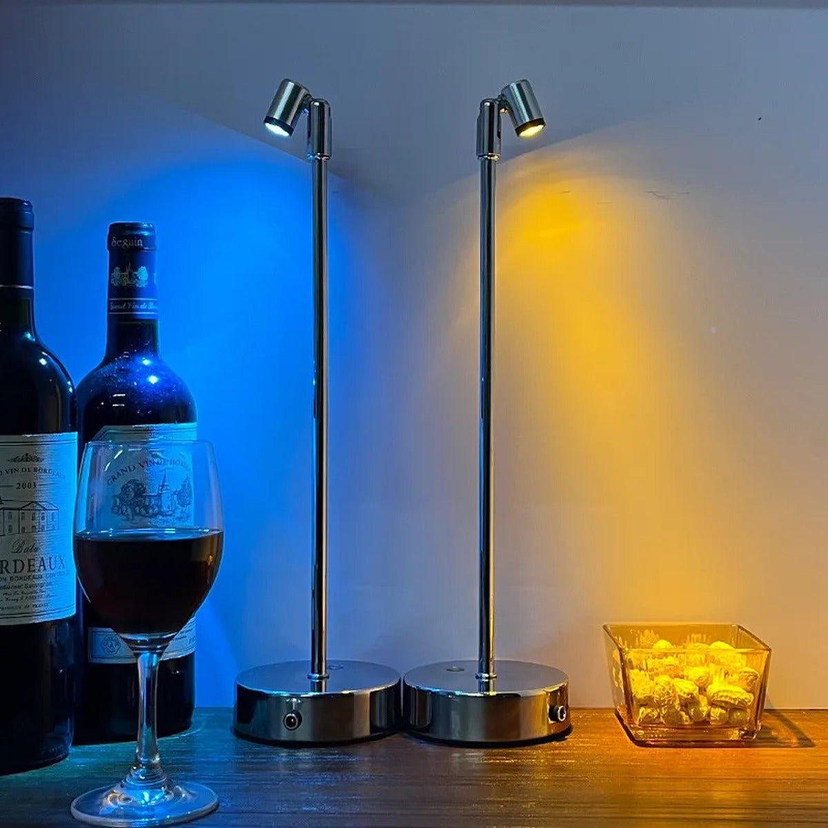 Tarvion — close-up of the rotatable spotlight head on the polished chrome pole, Warm White vs Amber Glow