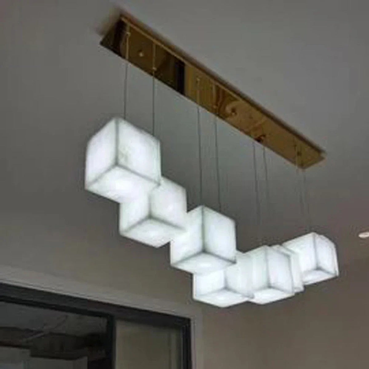 Rectalux alabaster stone cube pendant — angled view