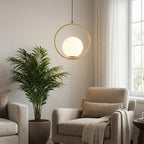 Aureon Brass Ring Opal Globe Pendant – Living Room Lifestyle