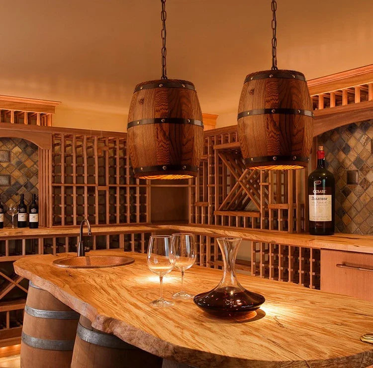 Suaelindra wood barrel pendant lights above a wine cellar bar counter