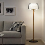 Minimalist Smoked Glass Floor Lamp Quieton — lifestyle view beside sofa